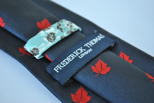 navy blue tie with canadian maple leaf design