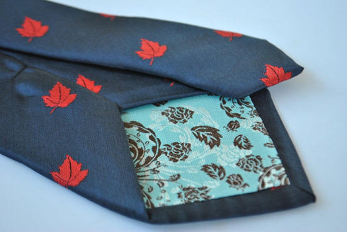 navy blue tie with canadian maple leaf design