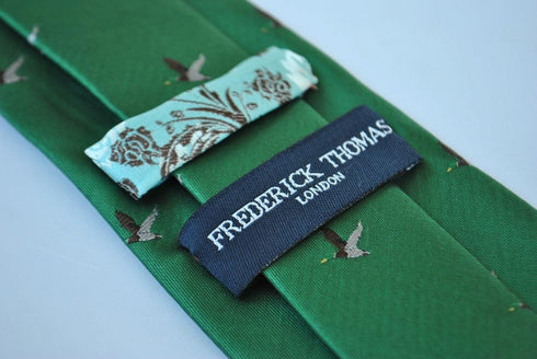 dark green tie with flying duck design