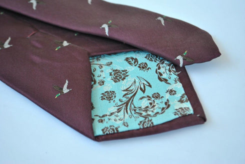 maroon tie with flying duck design
