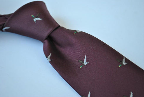maroon tie with flying duck design