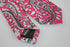 skinny cotton tie with bright pink floral and paisley design