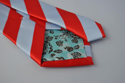 light blue and red barber stripe tie