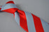 light blue and red barber stripe tie