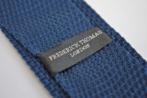 plain navy blue skinny knitted tie with pointed end