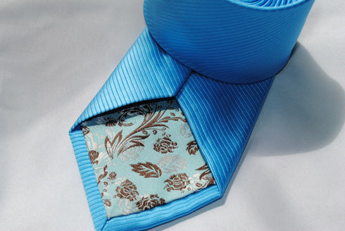 bright turquoise plain tie with a very subtle stripe