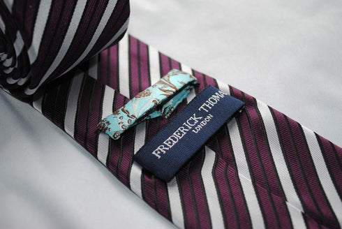 purple and white double stripe striped tie